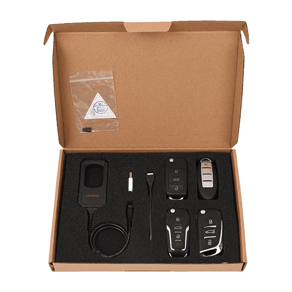 محتويات صندوق Launch X431 Key Programmer، تعرض الجهاز الرئيسي، المحولات المختلفة، والكابلات اللازمة لمهام البرمجة المتنوعة.
